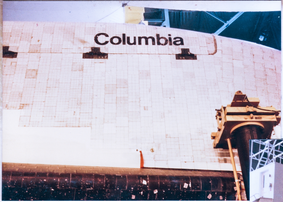 Inside the Vertical Assembly Building, at Kennedy Space Center, Florida, you are viewing the right side of Space Shuttle Columbia’s fuselage, the forward end of the payload bay door on that side, and some of the wing strake, all of which, just behind the crew cabin.